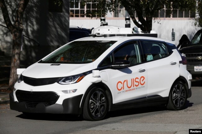 FILE - A self-driving GM Bolt EV is seen during a media event where Cruise, GM's autonomous car unit, showed off its self-driving cars in San Francisco, California, Nov. 28, 2017.