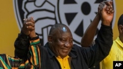 FILE - South African President Cyril Ramaphosa celebrates after being re-elected African National Congress president at the ANC national conference in Johannesburg, South Africa, Dec. 19, 2022. Ramaphosa announced the highly anticipated national election will be held May 29. 