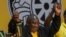 FILE— South African President Cyril Ramaphosa celebrates after being re-elected African National Congress president at the ANC national conference in Johannesburg, South Africa, December 19, 2022. 