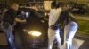 FILE - Cook County Sheriff police officers in Chicago, Illinois search a vehicle and a woman at street stop in the city's Austin neighborhood, September 9, 2015.