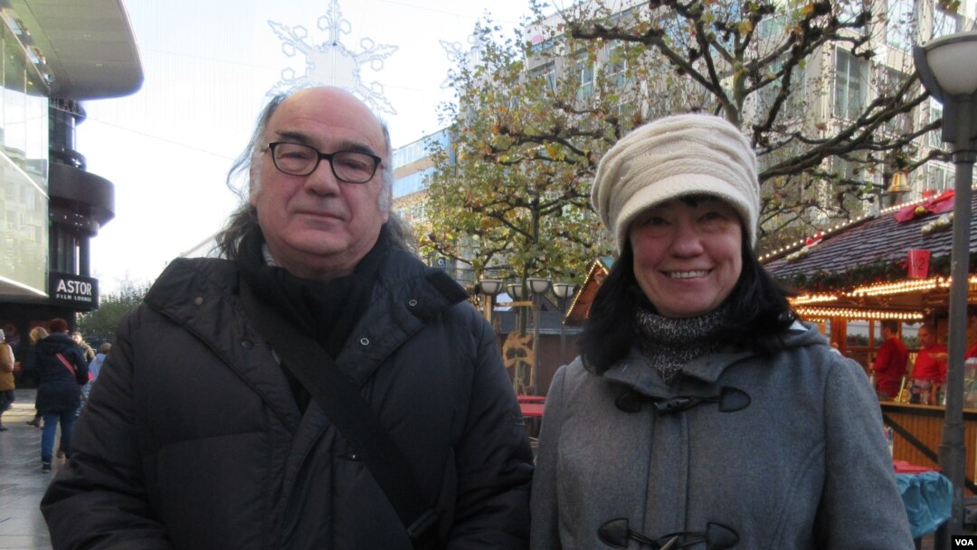 Ulrich Mueller, left, believes Schengen should continue, but controls on the EU border should be increased. (A. Tanzeem/VOA)