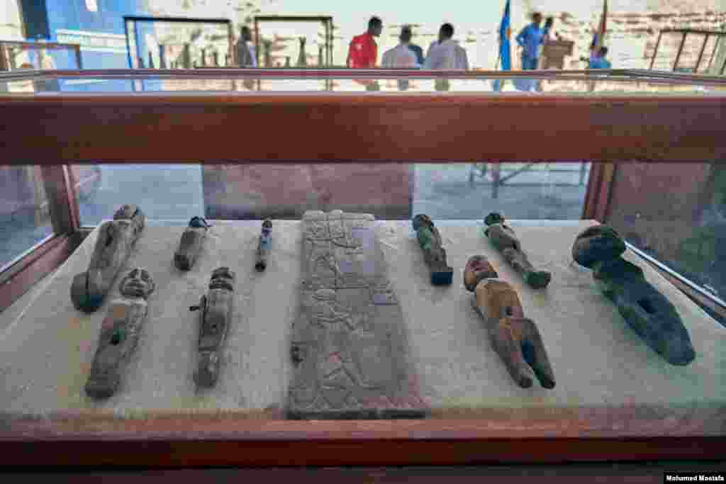 Wooden fragment with two figures carved on it. The depiction of both figures is influenced by foreign art, revealing ancient Egypt's interactions with neighboring cultures. (H. Elrasam/VOA)
