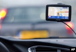 A TomTom navigation device is seen in this photo illustration taken in Amsterdam, February 28, 2012.