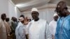 FILE — Senegalese President Macky Sall, center, leaves the presidential palace in Dakar on April 28, 2023. In an address to the nation on Feb. 3, 2024, Sall announced the indefinite postponement of the presidential election scheduled for Feb. 25, 2024.