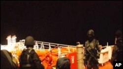 Picture from the Royal Malaysian Navy shows Somali pirates detained by Malaysian naval commandos following a firefight to free a hijacked oil tanker in the Gulf of Aden, 21 Jan 2011