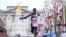 FILE - Kenya's Kelvin Kiptum breaks the tape to win the Men's race at the finish of the 2023 London Marathon in central London on April 23, 2023.