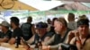People congregate at One-Eyed Jack's Saloon during the 80th annual Sturgis Motorcycle Rally on Aug. 7, 2020, in Sturgis, South Dakota. 