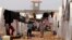 FILE - Syrian refugees walk under clothing lines at the Bab Al-Salam refugee camp in Azaz, near the Syrian-Turkish border, June 9, 2013. 