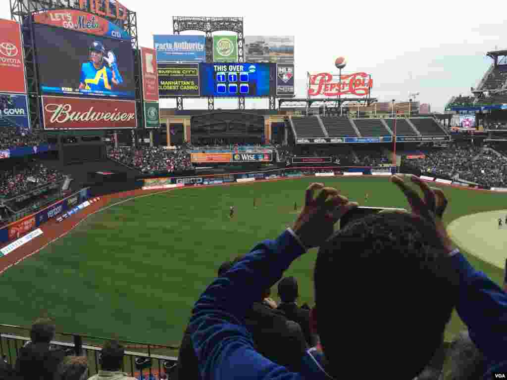 Fans cheer as India's 'God of cricket' Sachin Tendulkar takes stance to face a delivery. 