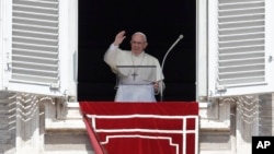 Pope Francis recites the Angelus noon prayer from the window of his studio overlooking St.Peter's Square, at the Vatican, Sunday, Sept. 2, 2018. 