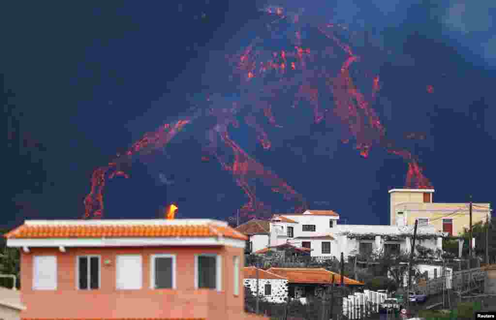 The Cumbre Vieja volcano continues to erupt, as seen from Tajuya, on the Canary Island of La Palma, Spain, Oct. 24, 2021.