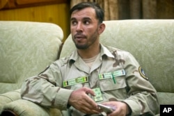 FILE - Gen. Abdul Raziq, Kandahar police chief, speaks during an interview with The Associated Press in Kandahar, Afghanistan Aug. 4, 2016.