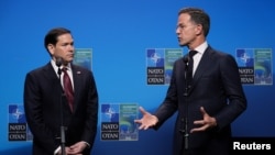 Marco Rubio, left, and Mark Rutte deliver a statement during a meeting of NATO foreign ministers in Sweden, Friday, May 22, 2026. 