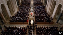The procession for the funeral mass for the late Supreme Court Associate Justice Antonin Scalia at the Basilica of the National Shrine of the Immaculate Conception in Washington, Feb. 20, 2016.