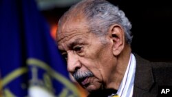 A woman who worked as a volunteer for John Conyers says she was sexually harassed by the former Democratic congressman.