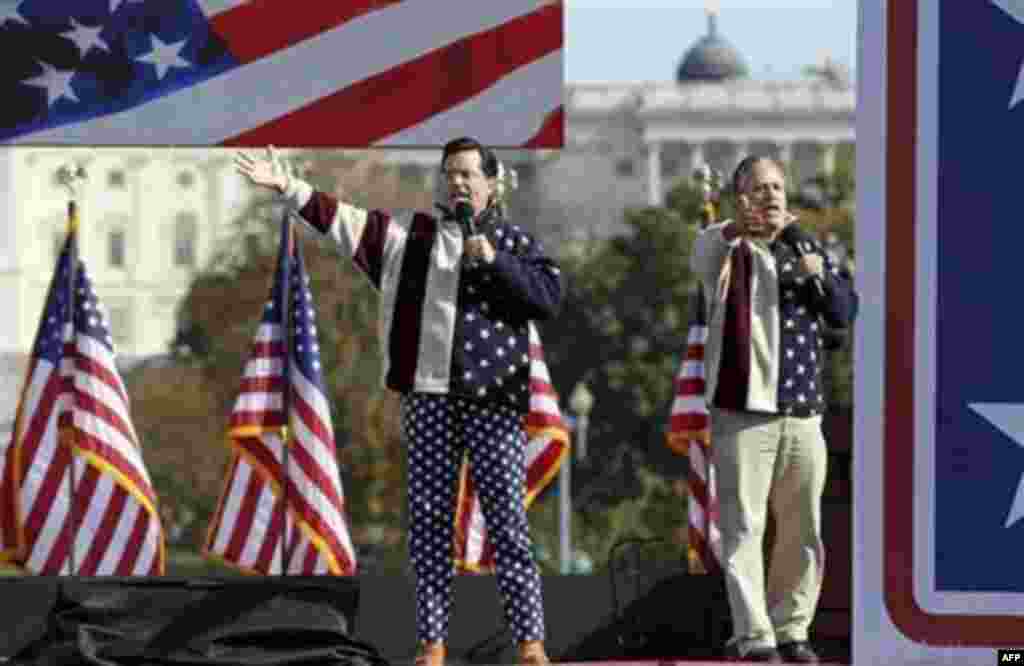 Comedians Stephen Colbert, left, and Jon Stewart perform during their Rally to Restore Sanity and/or Fear on the National Mall in Washington, Saturday, Oct. 30, 2010. The "sanity" rally blending laughs and political activism drew thousands to the mall wi