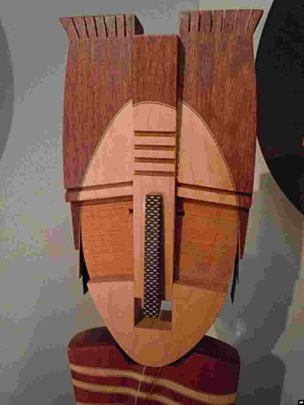 Wooden mask by furniture maker Ronald Dekok of Belleville, Wisconsin.