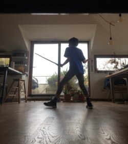 Life goes on for my son Mir, with his fencing classes online as he has spent weeks locked down at home, as all people under twenty are forbidden to leave home. (Courtesy D. Jones)