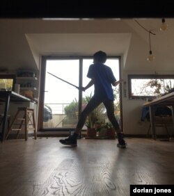 Life goes on for my son Mir, with his fencing classes online as he has spent weeks locked down at home, as all people under twenty are forbidden to leave home. (Courtesy D. Jones)