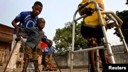 Boys with polio undergo therapy at the International Polio Victim Response Committe (IPVRC) compound in Democratic Republic of Congo's capital Kinshasa.