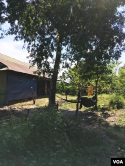 A soldier rests in a hammock at the newly established military camp in Smarch village of Siem Reap province’s Tram Sasar commune on Dec. 21, 2017. Although hundreds of soldiers registered to vote there in September, only a few were present at the camp in December(Julia Wallace/VOA Khmer)