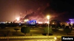 Smoke is seen following a fire at an Aramco factory in Abqaiq, Saudi Arabia, Sept. 14, 2019.
