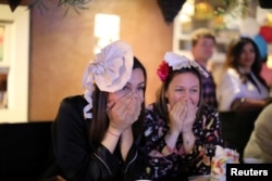 Women react during a royal wedding watching party for the wedding of Britain's Prince Harry and Meghan Markle at the Cat & Fiddle pub in Hollywood, Los Angeles, California, May 19, 2018.