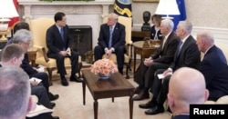 South Korea's national security chief, Chung Eui-yong, briefs U.S. President Donald Trump at the Oval Office about his visit to North Korea, March 8, 2018.