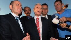 Mehmet Haberal, center, a surgeon and founder of an Ankara university, is accused of being part of an alleged ultra-nationalist and pro-secular gang called Ergenekon, Aug. 5, 2013.