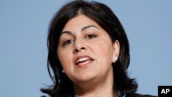 FILE - Britain's Chairman of the Conservative party Sayeeda Warsi speaks on the opening day of the Conservative party conference in Birmingham, England.