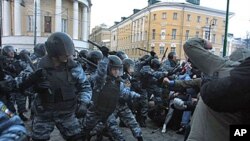 Football fans clash with riot police in central Moscow after Yegor Sviridov, 28, a dedicated fan of the Spartak Moscow football team was shot dead earlier this month, Dec 11, 2010