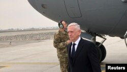FILE - U.S. Defense Secretary Jim Mattis lands in Kabul on an unannounced trip to Afghanistan, March 13, 2018. 
