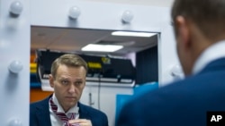 Russian opposition politician Alexei Navalny prepares for his interview with the Associated Press in Moscow, Russia, Dec. 18, 2017. 