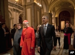 President Barack Obama walks with Cardinal Mario Aurelio Poli as he tours the Buenos Aires Metropolitan Cathedral in Buenos Aires, Argentina, March 23, 2016.