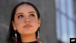 Samantha Maltais, of New Bedford, Mass., an incoming Harvard Law student, stands for a photograph, May 25, 2021, in New Bedford. 