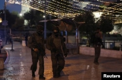 Israeli policemen secure the scene of the shooting and stabbing attack outside Damascus gate in Jerusalem's Old City June 16, 2017.