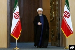 Iran's President Hassan Rouhani arrives for an address to the nation after a nuclear agreement was announced in Vienna, in Tehran, Iran, July 14, 2015.