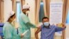 A man receives a vaccine as Cambodia starts its coronavirus disease (COVID-19) vaccine rollout with 600,000 doses of Sinopharm vaccine donated by China in Phnom Penh, Cambodia, February 10, 2021. (REUTERS/Cindy Liu)