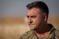 Maj. Gen. Eric Hill addresses the media at a U.S. military base at undisclosed location in eastern Syria, Nov. 11, 2019.