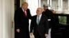 President Donald Trump, left, greets Iraqi Prime Minister Haider al-Abadi upon his arrival to the White House in Washington, March 20, 2017.
