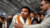 Nima Rinji Sherpa, who claims the record for youngest person to scale world's 14 highest peaks, is welcomed upon his arrival at the airport during a welcoming ceremony in Kathmandu, Nepal, Oct. 14, 2024. 