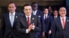 Chinese Premier Li Keqiang (2nd L) claps as he walks with Australian Prime Minister Tony Abbott (L), South Korean Prime Minister Jung Hong-won (R) during the opening ceremony of the Boao Forum for Asia (BFA) Annual Conference 2014 in Boao, Hainan province, April 10, 2014.