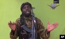 FILE - This photo taken from video by Nigeria's Boko Haram terrorist network, shows their leader Abubakar Shekau speaking to the camera.