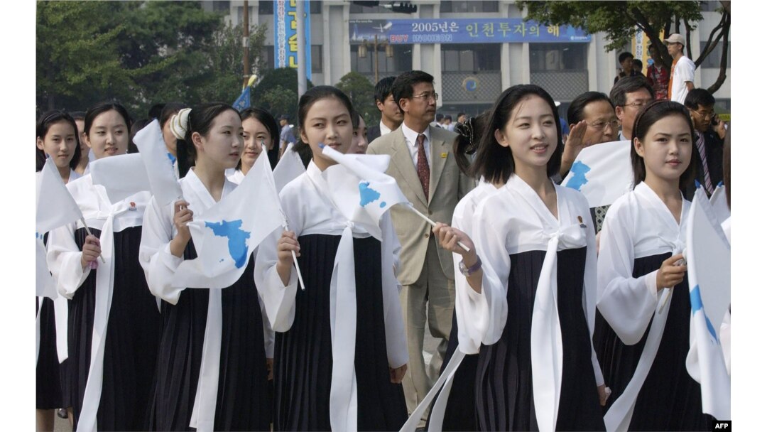 In this 2005 photo, North Korea's female cheerleaders, including a woman (right) believed to be North Korean leader Kim Jong-Un's current wife Ri Sol-Ju, attend the 2005 Asian Athletics Championships in Incheon.