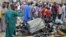 People look at the damages on March 2, 2014, after two explosions rocked a crowded neighborhood of Nigeria&#39;s restless northeastern city of Maiduguri, a stronghold of Boko Haram.