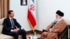 FILE - In this photo released by an official website of the office of Supreme Leader Ayatollah Ali Khamenei, right, Khamenei speaks with Syrian President Bashar al-Assad in Tehran, Iran, on Feb. 25, 2019. Analysts say Assad's exit from Syria weakens Iran regionally.