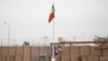 The Malian flag is hoisted during the handover ceremony of the Barkhane military base from the French to the Malian army in Timbuktu, on Dec. 14, 2021. 