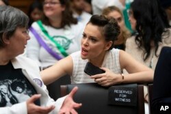 Actress and activist Alyssa Milano joins supporters of the Equal Rights Amendment at a House Judiciary Committee hearing on Capitol Hill in Washington, April 30, 2019.