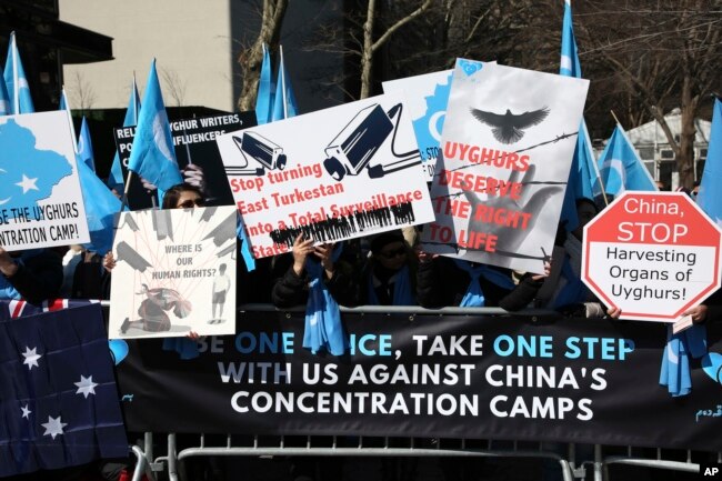 Uighurs and their supporters rally across the street from United Nations headquarters in New York, March 15, 2018, to protest a sweeping Chinese surveillance and security campaign that has sent thousands of their people into detention and political indoctrination centers.