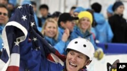 In this Feb. 25, 2010 file photo, Jeret Peterson of the United States, celebrates his Olympic silver medal in the men's freestyle aerials final at the Vancouver 2010 Olympics.